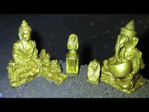 The boy was lucky to find two golden Buddha under the stone while searching for treasure in the wild