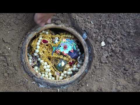 It's really lucky to find underground treasure under the huge rocks covered with mud